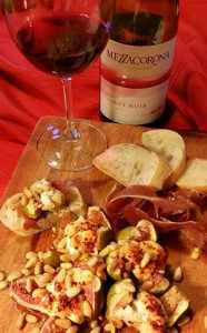 photo: Roasted fresh figs with goat cheese and rose-scented honey, with wine