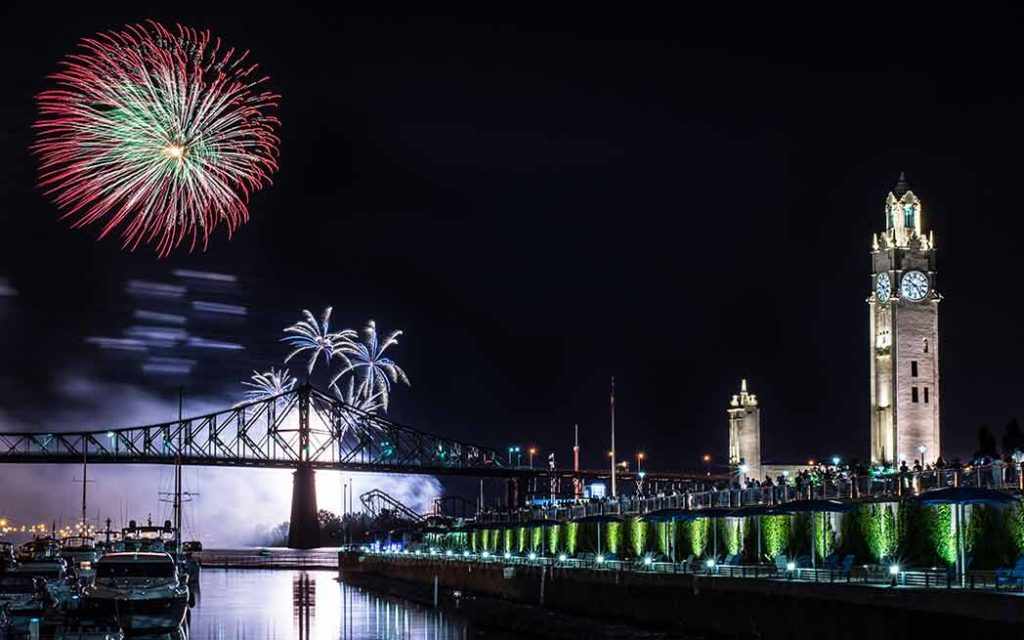 Montreal clock tower with fireworks WestmountMag.ca