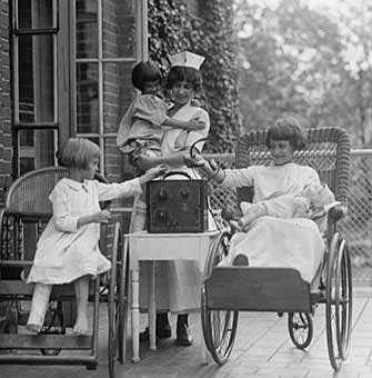 Listening to the radio in their own language <br /> Public Domain image