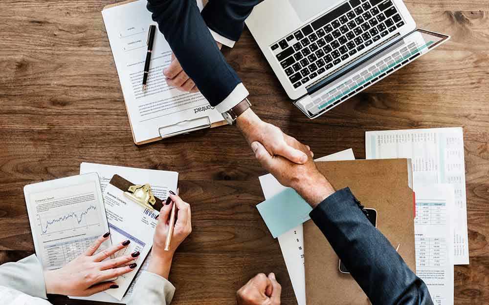 contract signing - WestmountMag.ca