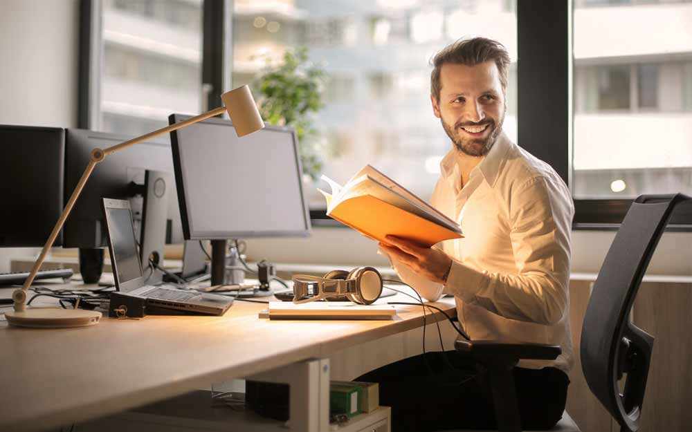 happy male employee - WestmountMag.ca