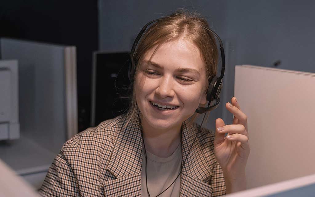 Woman answering call - Photo by Tima Miroshnichenko