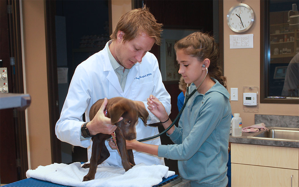 Dr. Cory Greenfield with dog and niece