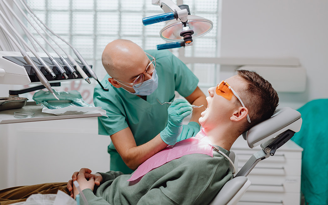 Dentist and patient at dental clinic