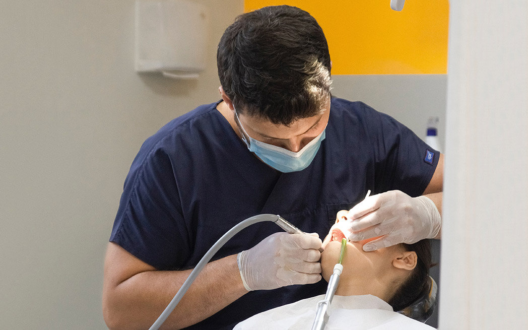 Dentist operating on patient - photo: Ozkan Guner
