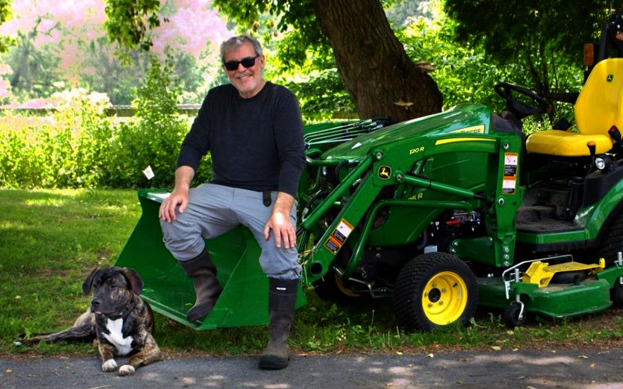 Men on tractor with dog