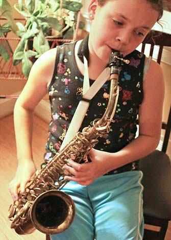 girl playing saxophone - WestmountMag.ca